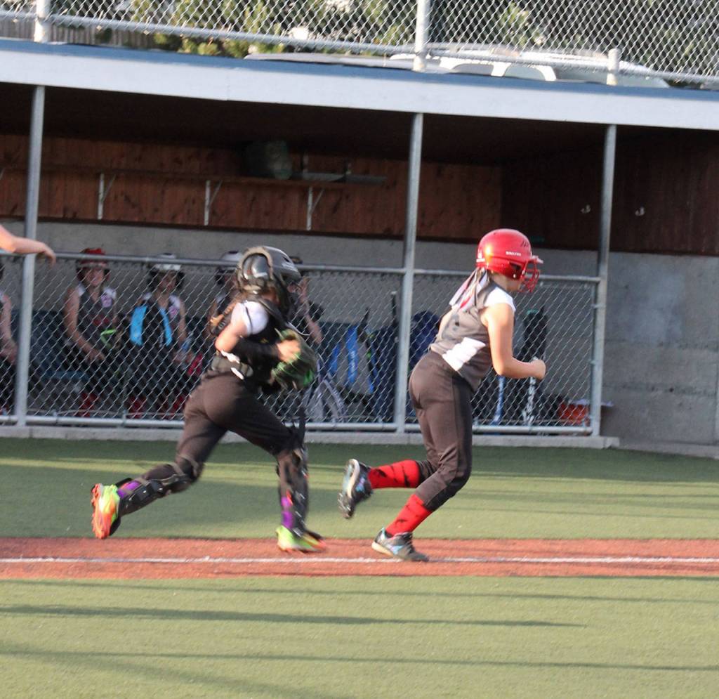 North Whidbeys Lilly Norman (catcher) and Central Whidbeys Mimi Forde.(Submitted photo)