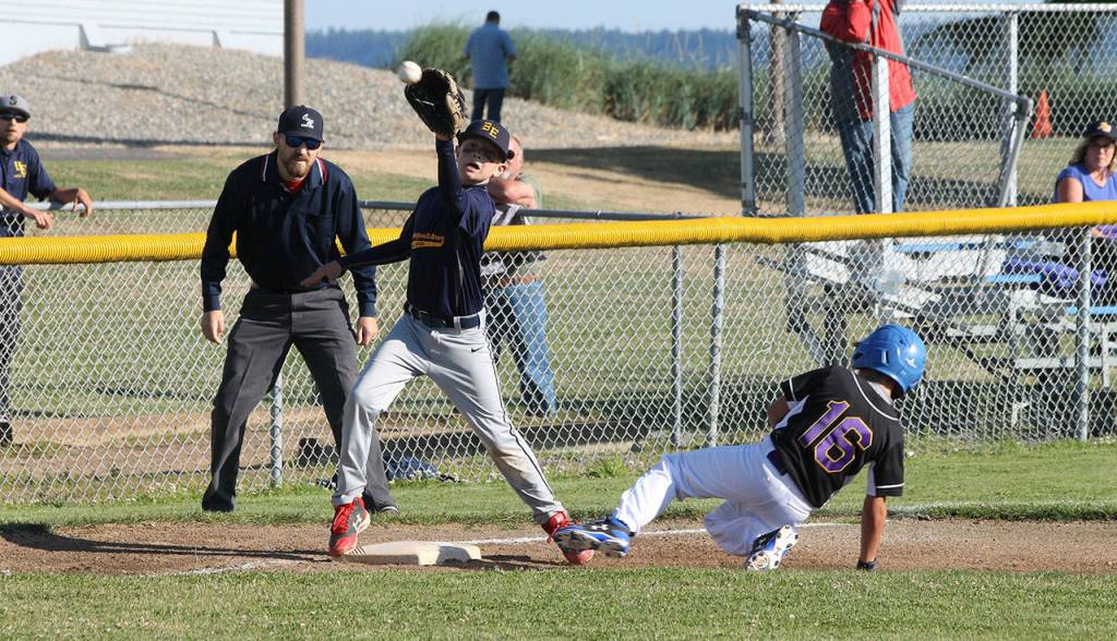 Trevor Sadler slides safely into third base as Burlingtons Asher Moe snags the throw.(Photo by Jim Waller/Whidbey News-Times)