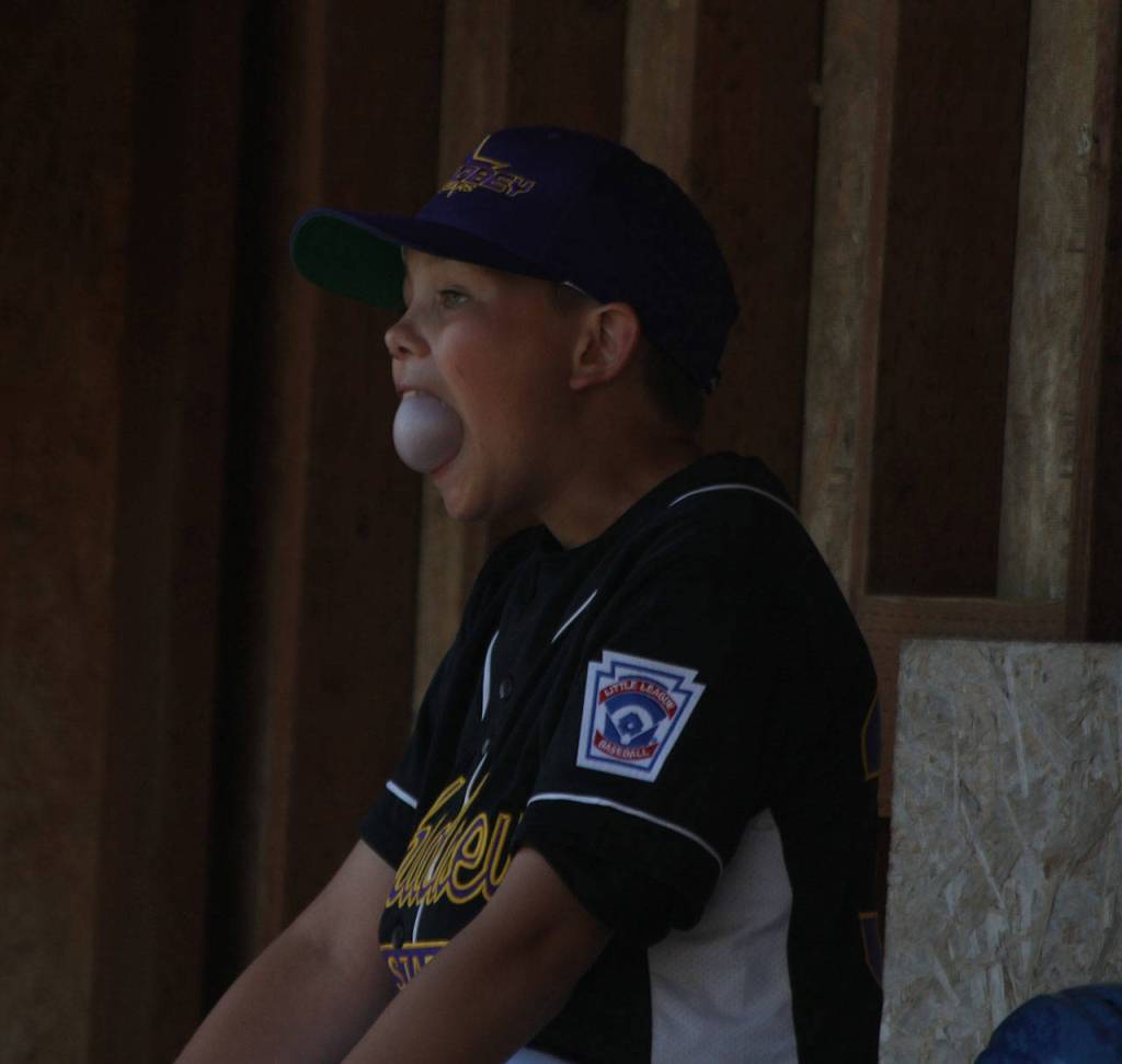 Saxon Gluth continues baseballs bubble-blowing tradition. (Photo by Jim Waller/Whidbey News-Times)