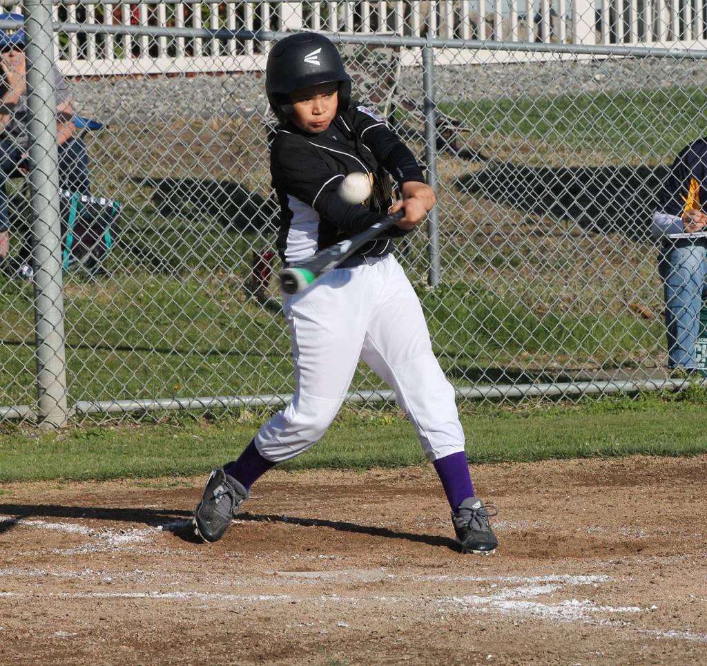 Nikko Gonzales drives a double for North Whidbey.(Photo by Jim Waller/Whidbey News-Times)