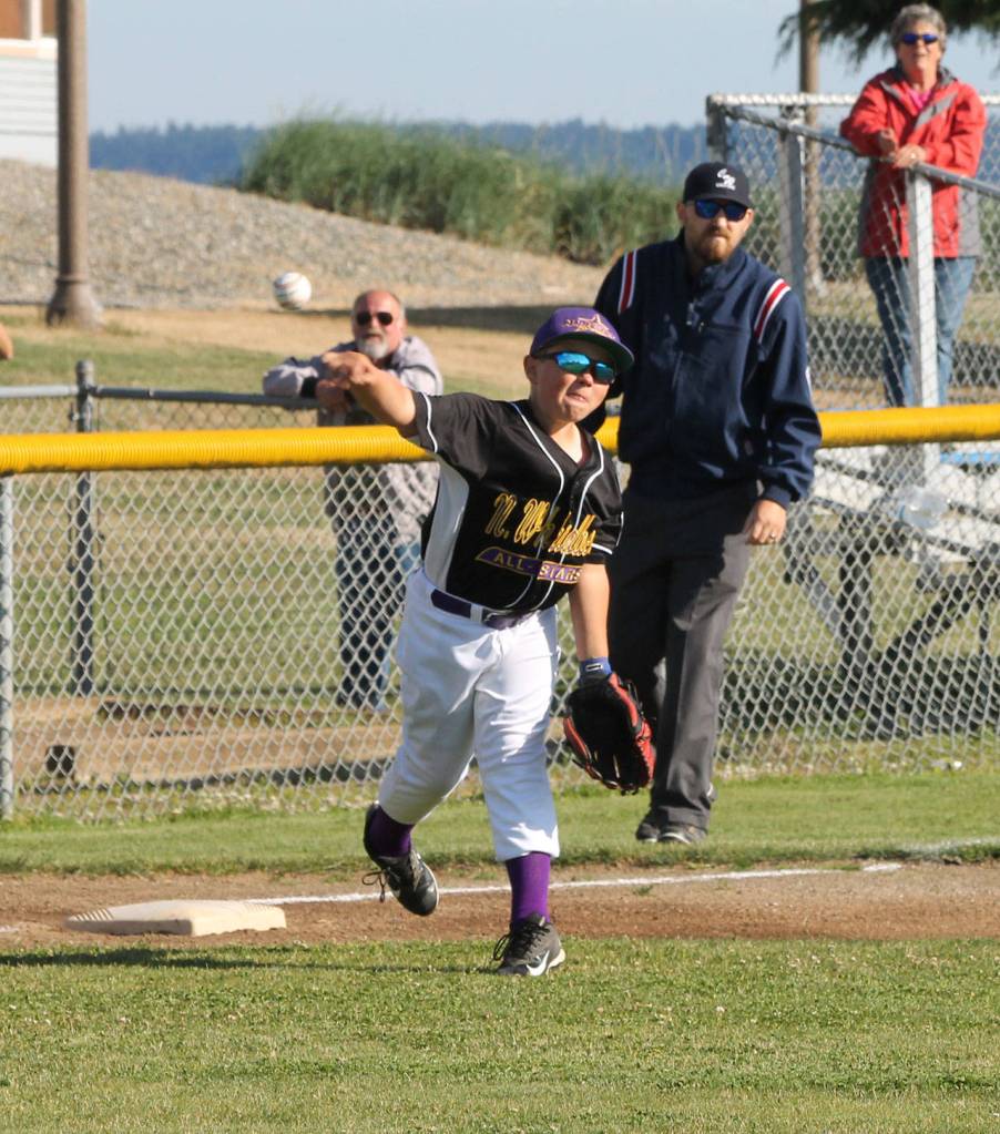Third baseman David Smith fires across the diamond.(Photo by Jim Waller/Whidbey News-Times)