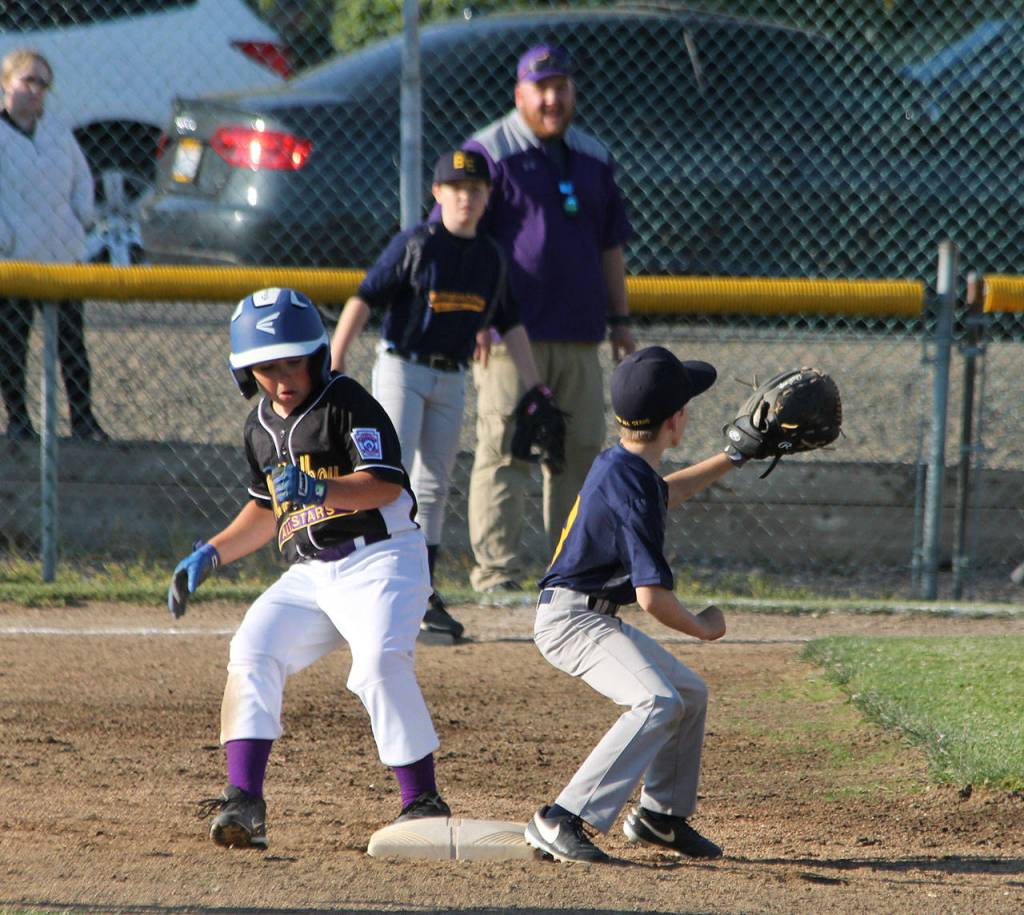 David Smith ducks into second base as Burlingtons Landon Stallings awaits the throw.(Photo by Jim Waller/Whidbey News-Times)