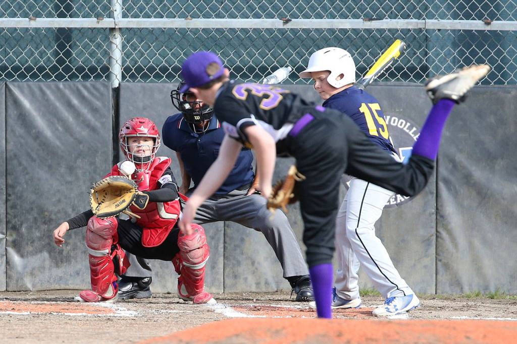 North Whidbeys Nate Moore tosses a pitch to catcher Jacob Figarelle.(Photo by John Fisken)