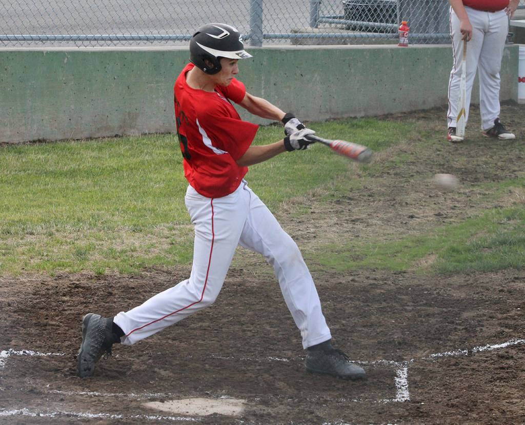 Cody Roberts put the ball in play in the Mount Vernon doubleheader.(Photo by Jim Waller/Whidbey News-Times)