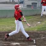 Urlik Wells smacks a two-run double in the first inning to get the Wolves off to a good start.(Photo by Jim Waller/Whidbey News-Times)