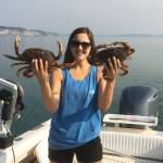 Coupeville resident Kelsey Miranda holds up two of her catches last summer. Crabbing season opens Saturday and Island County Marine Resources Committee and Northwest Straights Foundation are providing tips to prevent losing crab pots. Photo provided.