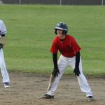 Sage Sharp, right, and the Coupeville 15U Babe Ruth team is heading to the state tournament later this month. (Photo by Jim Waller/Whidbey News-Times)