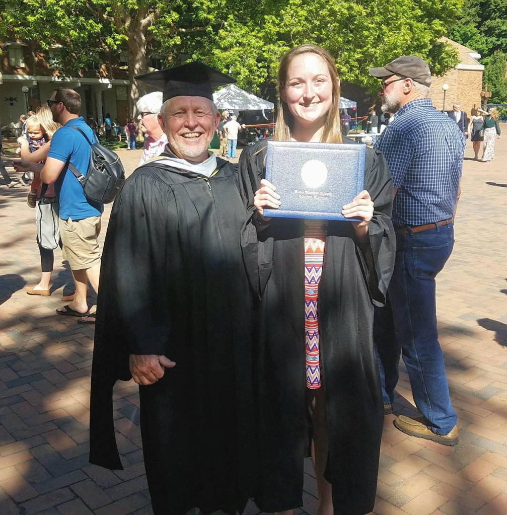 Alexandra Laiblin, joined by Western Washington University track coach of 31 seasons Pee Wee Halsell, shows off her diploma. (Photo courtesy of WWU Athletics)