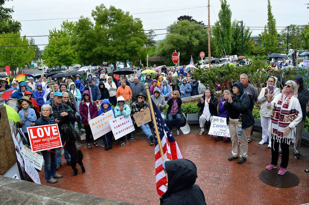Around 200 people gathered Saturday morning at the Island County Veterans Memorial Plaza in Coupeville to protest the separation of undocumented immigrant families. Photo by Laura Guido/Whidbey News-Times