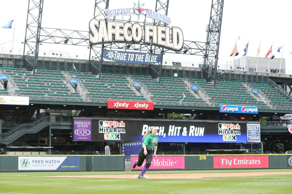 Katie Bishop competes in the Pitch, Hit and Run contest at Safeco Field Sunday.(Photo by John Fisken)