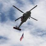 Photo by Jessie Stensland / Whidbey News-Times                                A search-and-rescue helicopter from Whidbey Island Naval Air Station flies overhead.