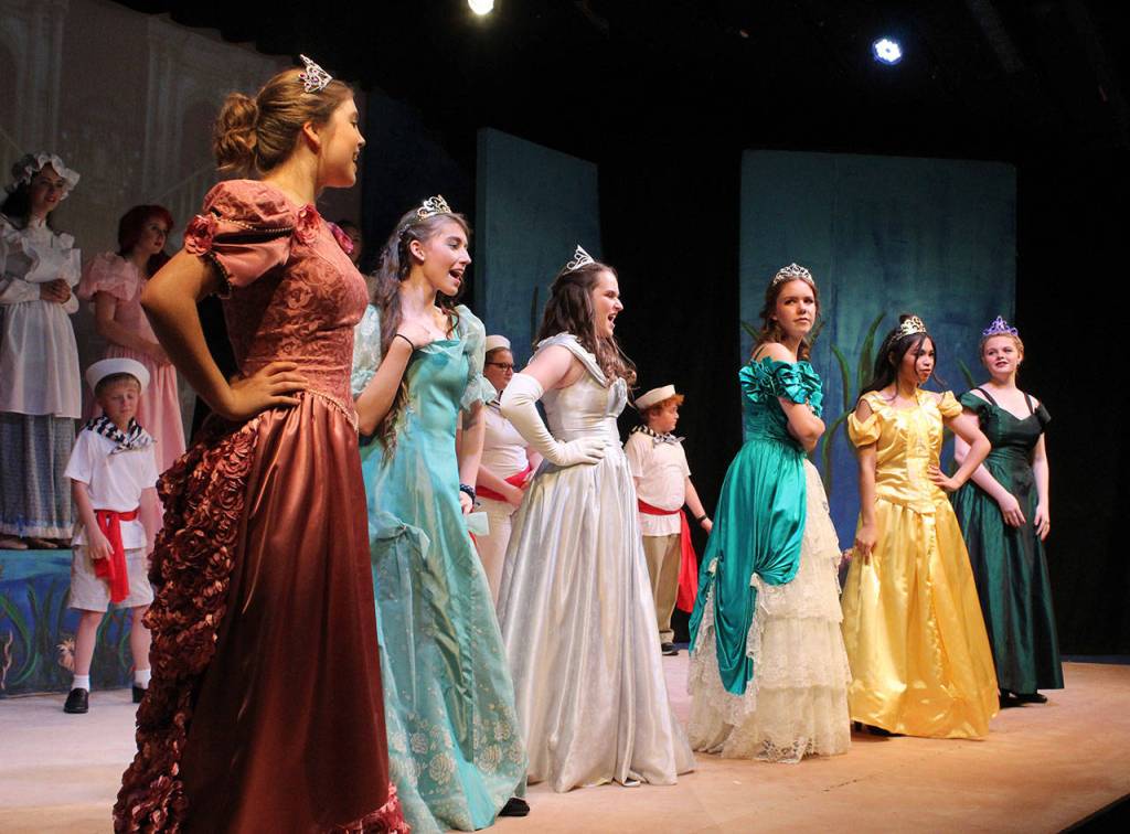 A pack of princesses vie for the attention of Prince Eric. Photo by Patricia Guthrie/Whidbey News Group
