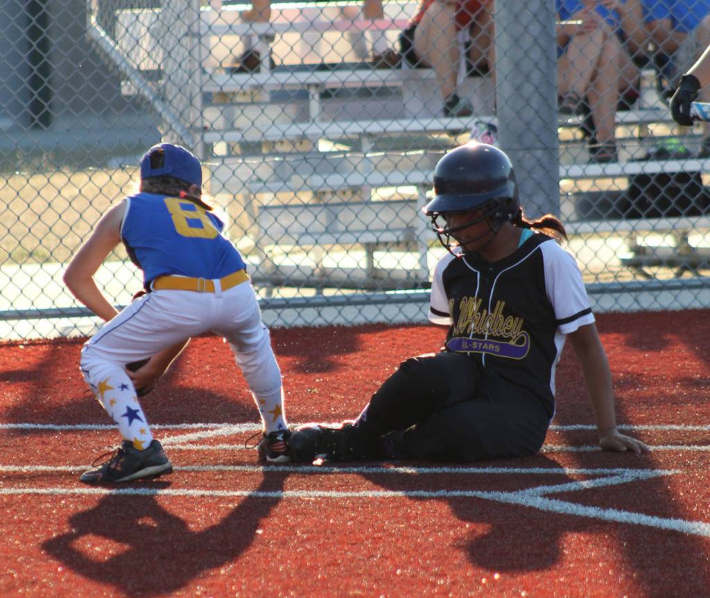 Loto Tupu scores ahead of the tag of North Clarks Lorelie Brown.(Photo courtesy of Liz Davis)