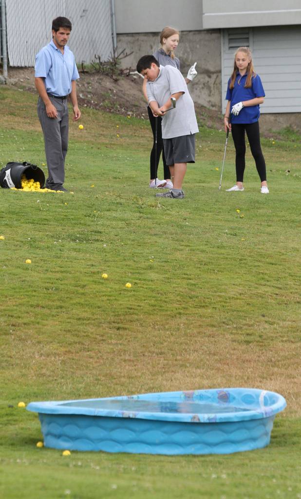 Antonio Rodgers attempts to hit the target, a water-filled swimming pool.(Photo by Jim Waller/Whidbey News-Times)