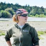 Jessica Larson, land steward at the Whidbey Camano Land Trust, looks out at Dugualla Bay from the nonprofits reserve. Two years ago the land trust partnered with the Washington State Department of Transportation to restore wetlands to create salmon habitat. Larson said the effort has been successful so far. Photo by Laura Guido/Whidbey News-Times