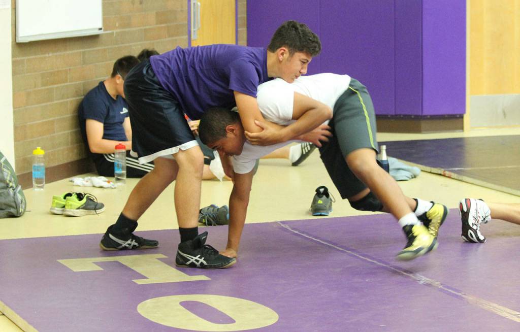 Zach Badaouie, left, and Noah Hangan pair-up to work on technique. (Photo by Jim Waller/Whidbey News-Times)