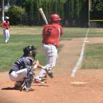 Johnny Carlson puts the ball in play for the Wolves. (Photo by Karen Carlson)