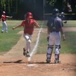 Coupevilles Scott Hilborn scores the games first run.(Photo by Karen Carlson)