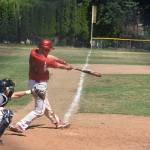 Gavin Knoblich raps a run-scoring hit in the first inning.(Photo by Karen Carlson)