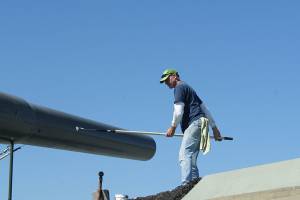 Photos by Maria Matson/Whidbey News-Times                                John White of Freeland works to paint the Big Guns at Fort Casey. It was a good day to paint, with the sunshine and fresh air, he said. The work is being done by volunteers in preparation for the 50th anniversary of the Big Guns arrival, which will be held on Aug. 11.