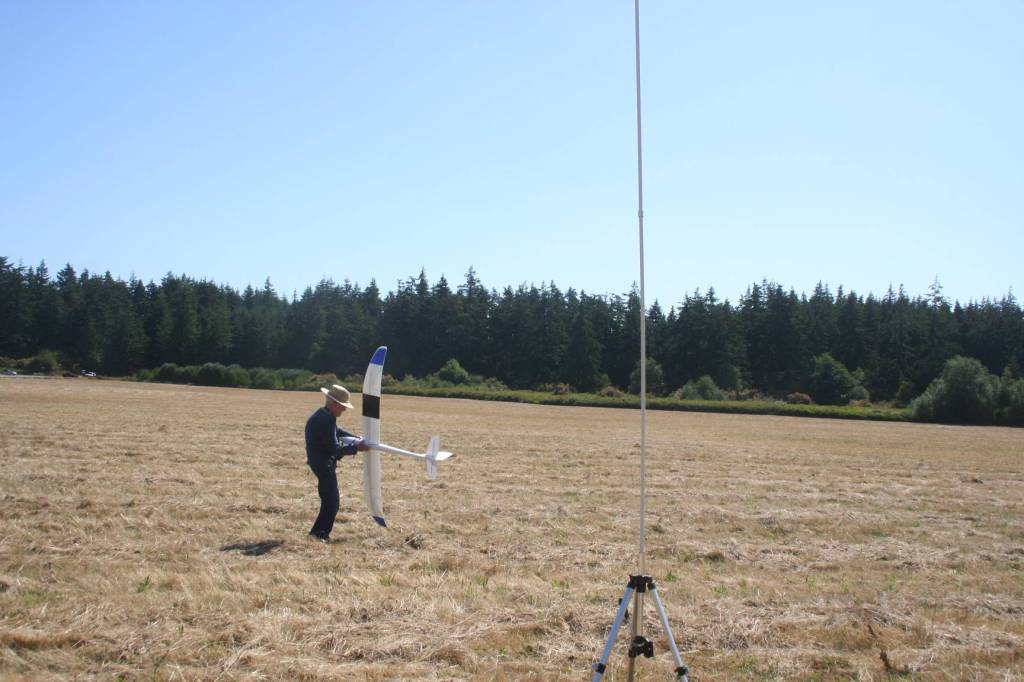 Donald Ridlon gets ready to launch a glider, which club members say is used to teach new fliers how to control the plane. Photo by Abigail Gilbert.