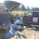 Photo by Abigail Gilbert.                                Scott Storer explains that this alien spaceship-looking aircraft is good for mapping since it can take in precise GPS coordinates.