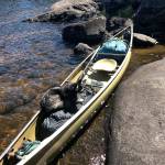 Photo by Jim Christensen.                                The rented canoe is hauled ashore at a stopping point.