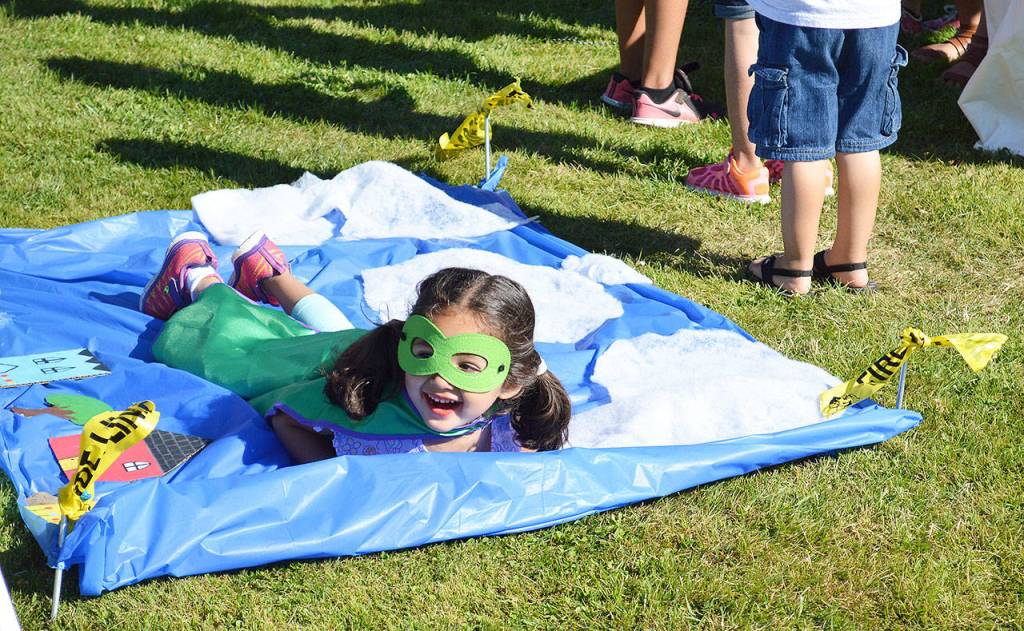 Trini Garcia, 3, poses for a super photo Tuesday night at Fort Nugent. Photo by Laura Guido/Whidbey News-Times