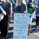 Maya Kilmer holds up a sign at a Oak Harbor Education Association rally Tuesday morning. Photo by Laura Guido/Whidbey News-Times
