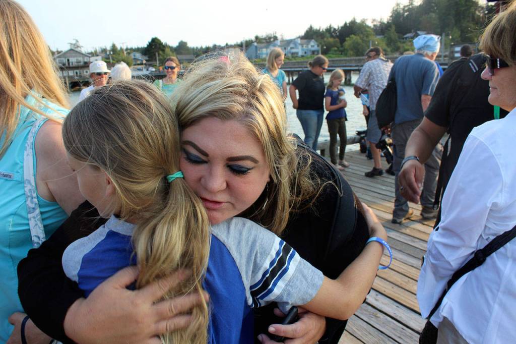 Michelle Seidelman, with Sea Shepherd in Portland, makes the round of hugs that ended the somber event. She travels to the Bring Tokitae Home gathering every year.