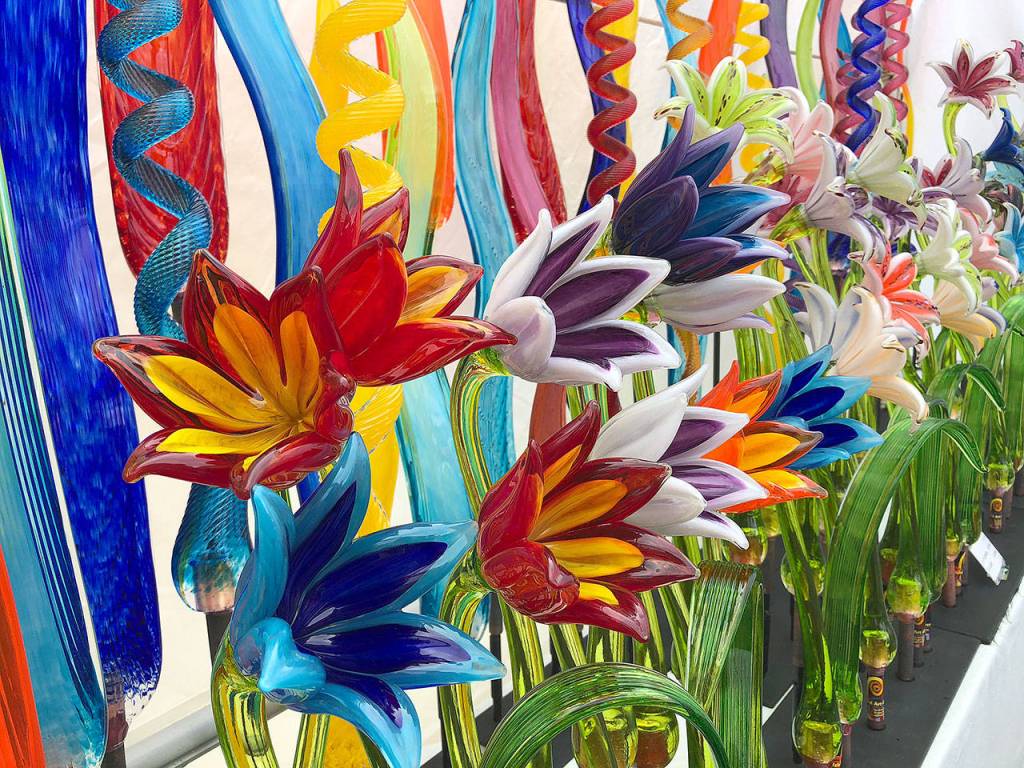 Flowers by glass artist Rob Adamson of Langley sit on display Saturday at the Coupeville Arts and Crafts Festival. Photo by Emily Gilbert/Whidbey News Group