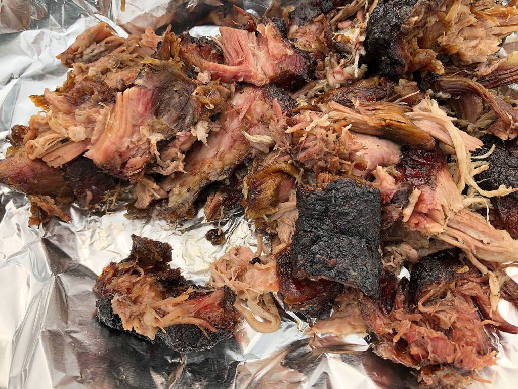 The huge smoke pit turned out some piping hot and flavorful barbecue meat, which was served to the thousands of people who came out to Pigfest on Sunday. Photo by Emily Gilbert/Whidbey News-Times