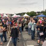 Thousands of people came to the 11th annual Pigfest in Oak Harbor Sunday to try Scott Frasers barbecued pork from a potentially record-setting smoke pit. Photo by Emily Gilbert/Whidbey News-Times