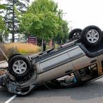 Jeep rolls in front of hospital