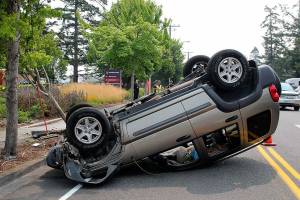 Jeep rolls in front of hospital