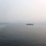 A ferry heading out of Clinton Monday morning is almost lost in the regional haze coming from hundreds of wildfires burning in Canada, Oregon and central Washington. (Photo by Patricia Guthrie/Whidbey News Group)