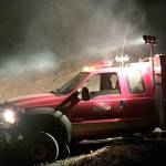 Photo provided.                                Smoke rises from a large pile of logging debris that caught fire around midnight on Tuesday at Kempton Place. The pile was created from clearing for a county road project.
