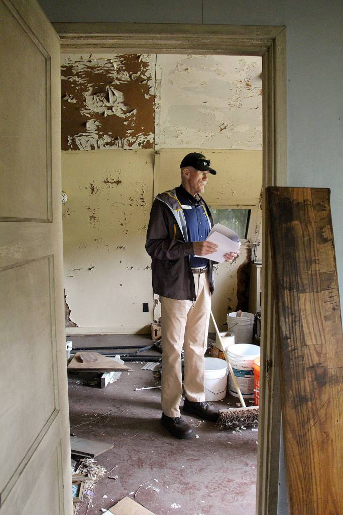 Wil Shellenberger stands in what he believes is the last Quonset hut from the WWII-era Homoja housing program thats left in its original configuration. The PBY Memorial Foundation is trying to save it from demolition. Photo by Laura Guido/Whidbey News-Times