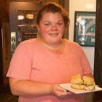 Oak Harbor store manager Michelle Berger holds the locations best seller, the Turkey Club. She came up from the Clinton location to manage the new store when it opened in April. Photo by Emily Gilbert/Whidbey News Group.