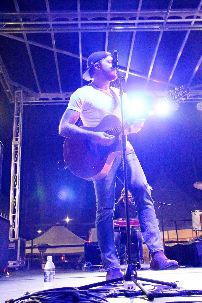 Backup vocalist and guitarist Taylor Abram of James Barker Band performs Saturday night. Photo by Laura Guido/Whidbey News-Times