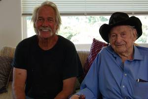 Photos by Maria Matson / Whidbey News Group                                <em>Bob Becker and his son, Bob Becker Jr., sit at Beckers house in Coupeville. Becker turned age 103 on Sept. 11.</em>