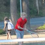 Jaschon Baumann follows the flight of his serve.(Photo by Jim Waller/Whidbey News-Times)