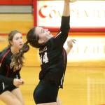 Ashley Menges hits for the Wolves. (Photo by John Fisken)