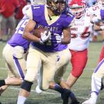 Aaron Martinez looks for some running room Friday.(Photo by John Fisken)