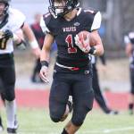 Sean Toomey-Stout picks up big yardage for the Wolves.(Photo by John Fisken)