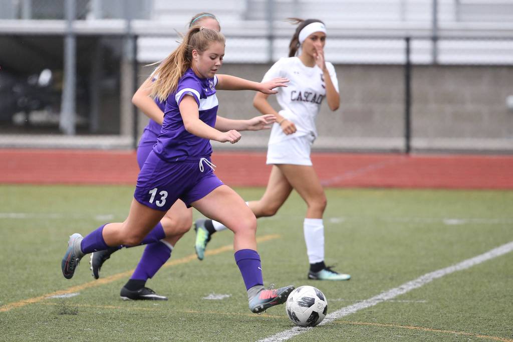 Natalie Plush races the ball up field.(Photo by John Fisken)