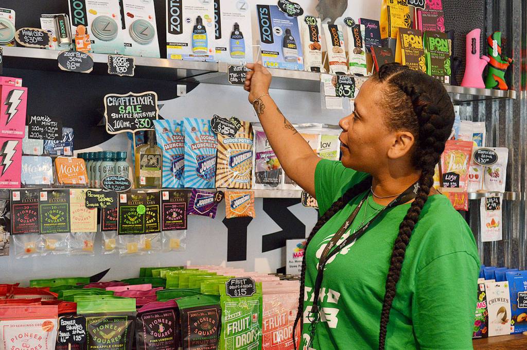 Valerie Boothe explains which of Island Herbs edible cannabis products are most popular with customers. Photo by Laura Guido/Whidbey News Group
