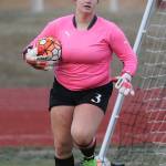 Coupeville keeper Sarah Wright hustles to put the ball in play.(Photo by John Fisken)