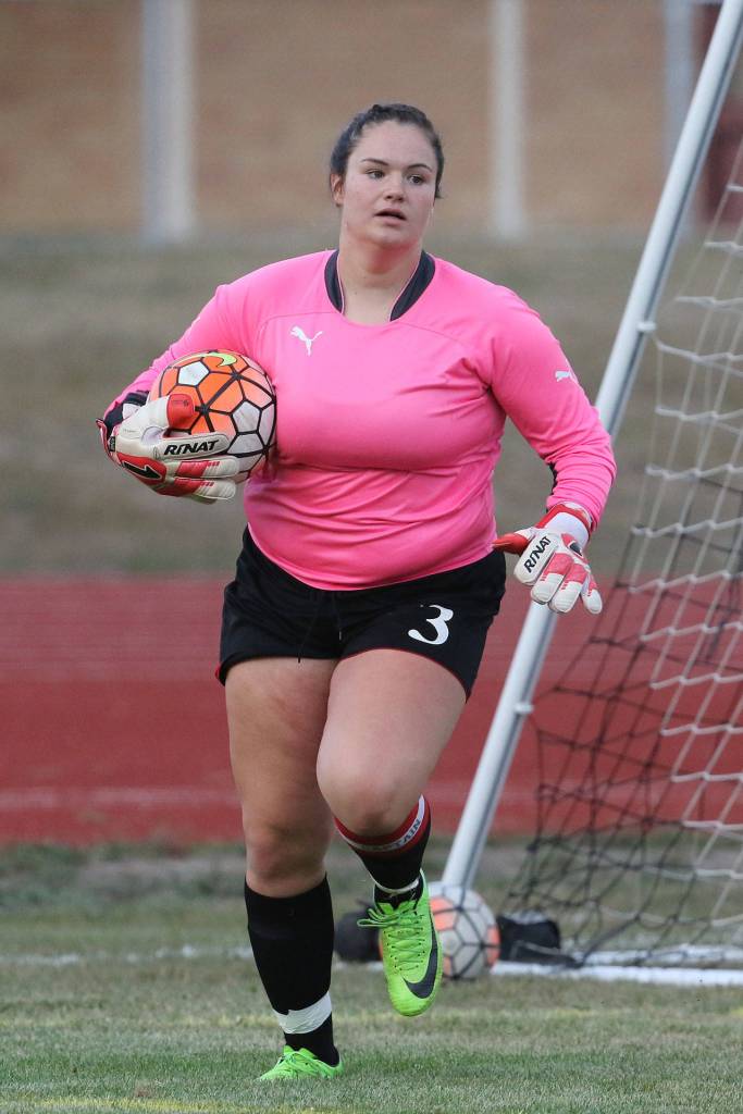 Coupeville keeper Sarah Wright hustles to put the ball in play.(Photo by John Fisken)