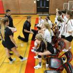 Coach Cory Whitmore talks to his team during a break in the Anacortes contest.(Photo by John Fisken)